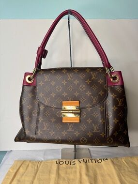 LOUIS VUITTON
Aurore Monogram Canvas Olympe Bag